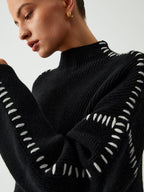 Suéter de cuello alto oversize con detalles de piqué