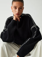 Suéter de cuello alto oversize con detalles de piqué
