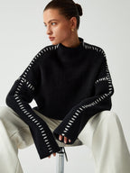 Suéter de cuello alto oversize con detalles de piqué