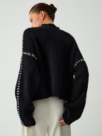 Suéter de cuello alto oversize con detalles de piqué